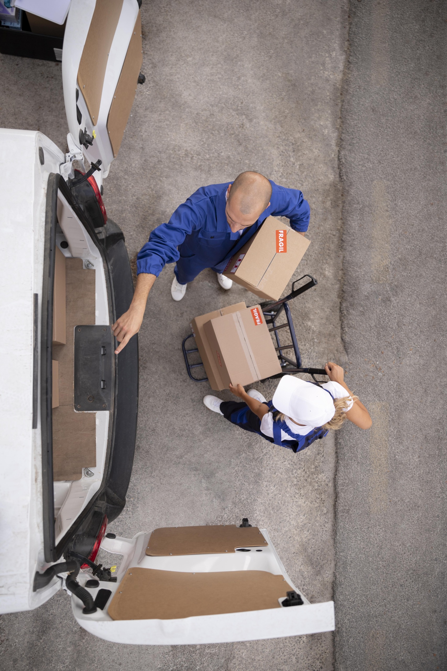 full-shot-delivery-people-holding-box full-shot-delivery-people-holding-box-scaled.