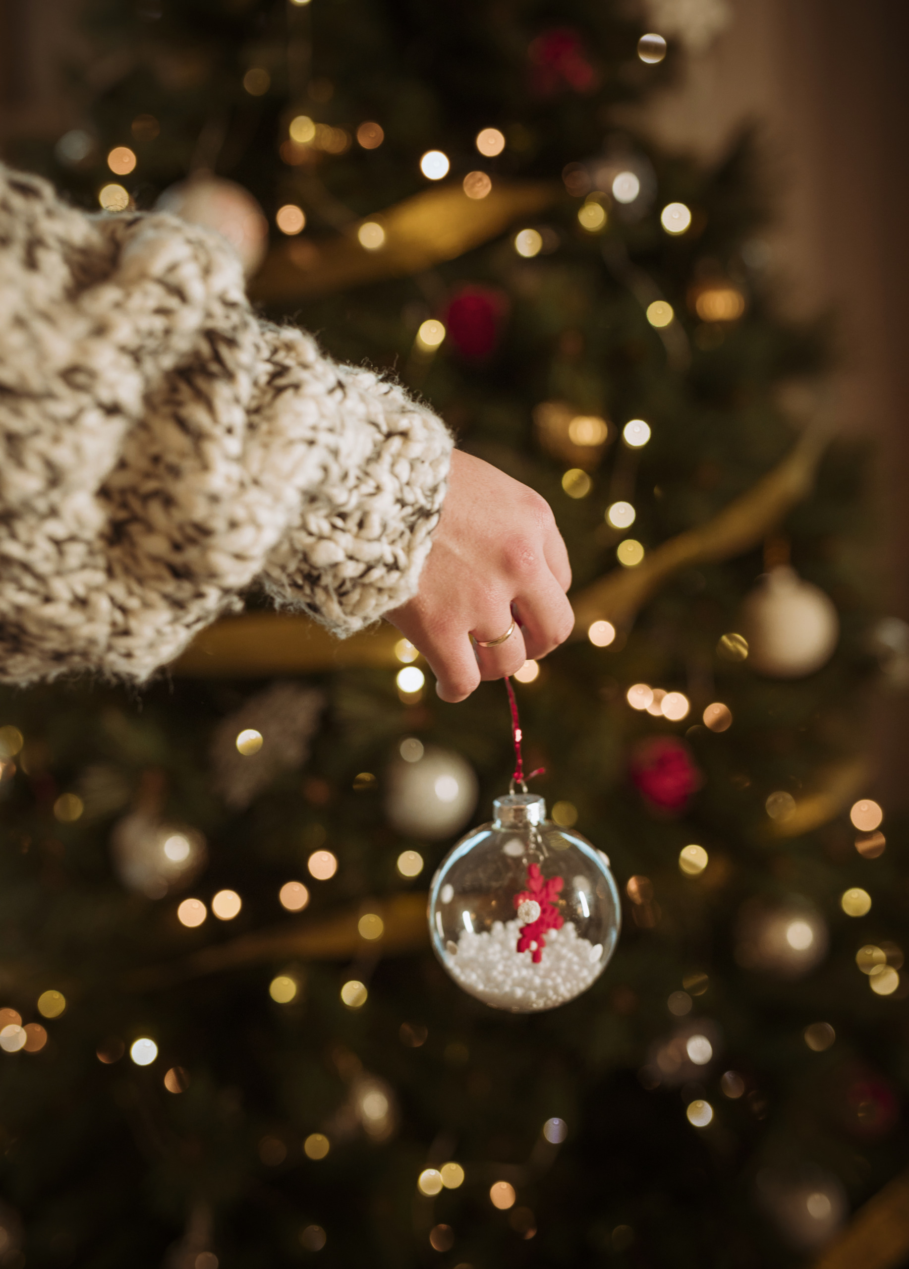 woman-holding-bauble-hand woman holding bauble hand